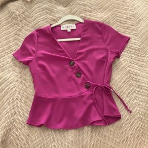 Purple/magenta blouse.